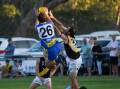 MCUE defender Lachie Johnson flies high in a marking attempt during the Good Friday season-opener at Mangoplah Sportsground. Picture by Bernard Humphreys