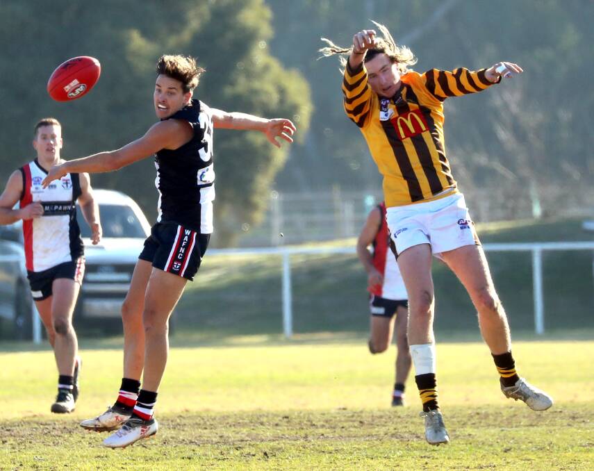 UP FOR GRABS: North Wagga's Ben Alexander and East Wagga-Kooringal's Kyle North-Flanagan compete during the Farrer League game at McPherson Oval on Saturday. Picture: Les Smith