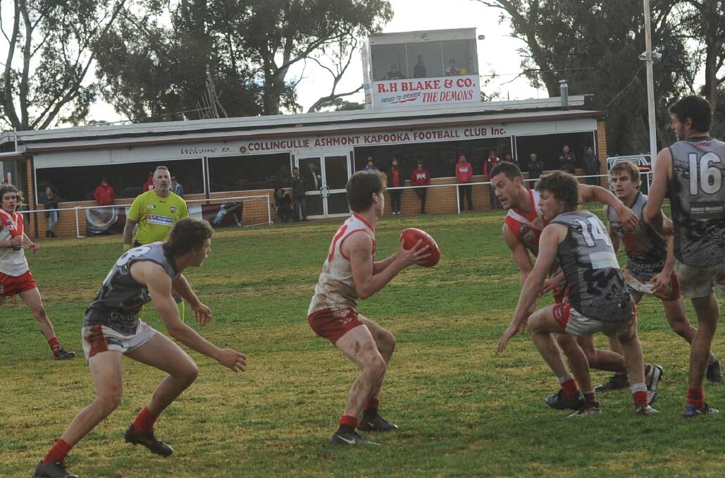 THRILLER: Griffith's Isaac Campbell tries to find a way out of trouble in the Swans' two point win against Collingullie-Glenfield Park. Picture: Matt Malone