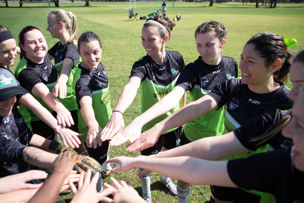 South Wagga women's players put their hands in at Rawlings Park before the club's final Leonard Cup match of the 2023 season. Picture by Madeline Begley.