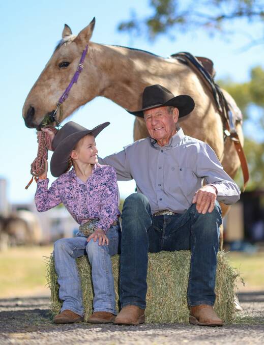 One of Mount Isa Rodeo's youngest competitors, Tooma's Katie Pierce, 8, with the world's oldest and Cootamundra cowboy Bob Holder, 92, who competed with her great-grandfather. Picture contributed
