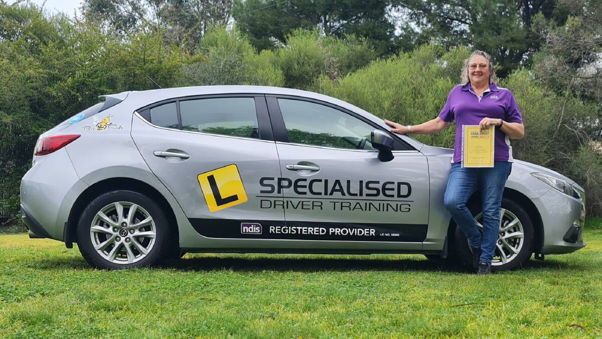 NDIS driver trainer Linda Roesler with her car, modified to train people with disabilities and even stroke victims. Picture contributed