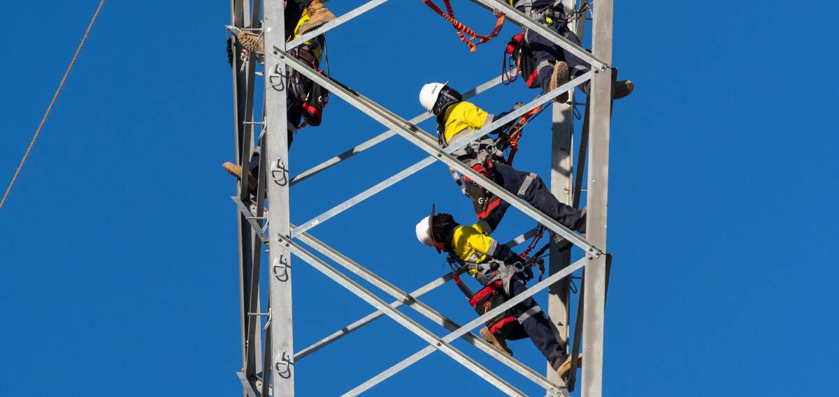 Riggers at work on an EnergyConnect tower at Buronga. Picture contributed