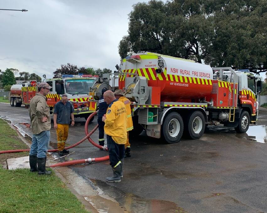 Hay Rural Fire Service crews pump water out of the town after a flash flood at the weekend. Picture supplied