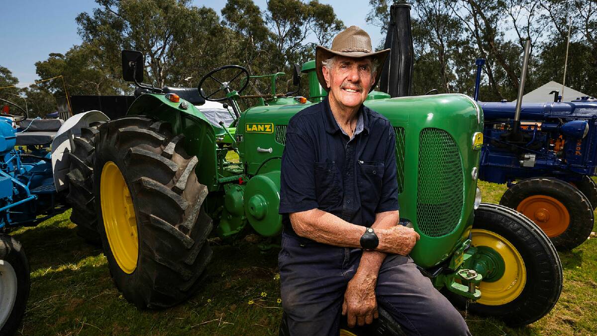 Former farmer turned antique machinery enthusiast, Kerry Pietsch attended the first Henty Field Day in 1963. He is pictured with a 1963 John Deere-Lanz tractor at Henty on Monday. Picture by Ash Smith