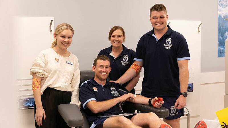 Wagga Public School's Jo Neilsen (centre back) supports about 20 colleagues at the Australian Red Cross Lifeblood donor centre, including first-time donors Caitlan Tull and Marshal Macauley and second-time donor Sam Wilkes. Picture by Madeline Begley