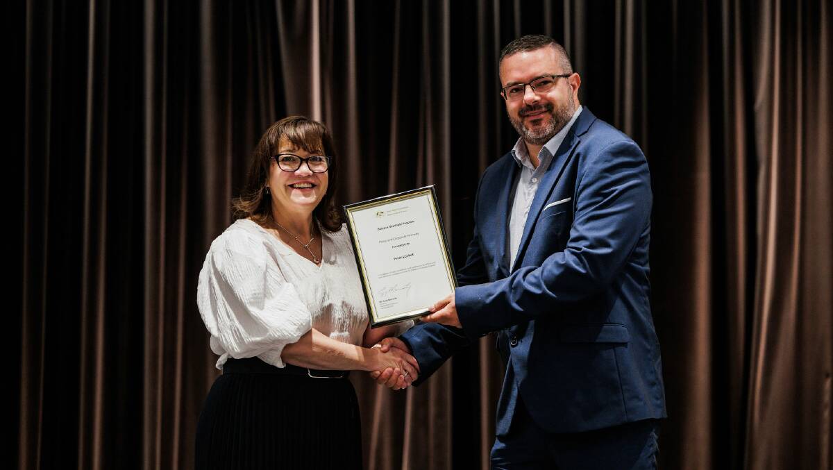 Department of defence Indigenous Pathway graduate Peter Vonhoff receives his graduate certificate from Celia Perkins, deputy secretary Security and Estate Group and Defence Indigenous Champion in Canberra earlier this year. Picture contributed
