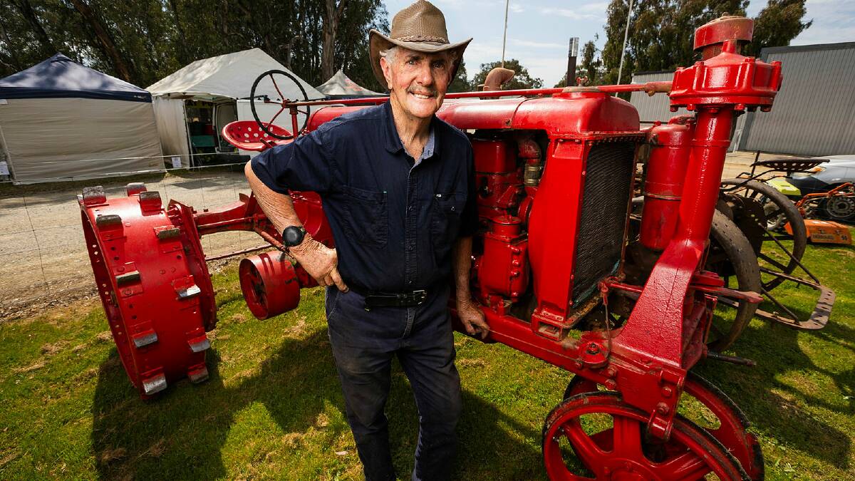 Henty and District Antique Farm Machinery Club president Kerry Pietsch pictured with a vintage Farmall tractor at Henty on Monday. Picture by Ash Smith