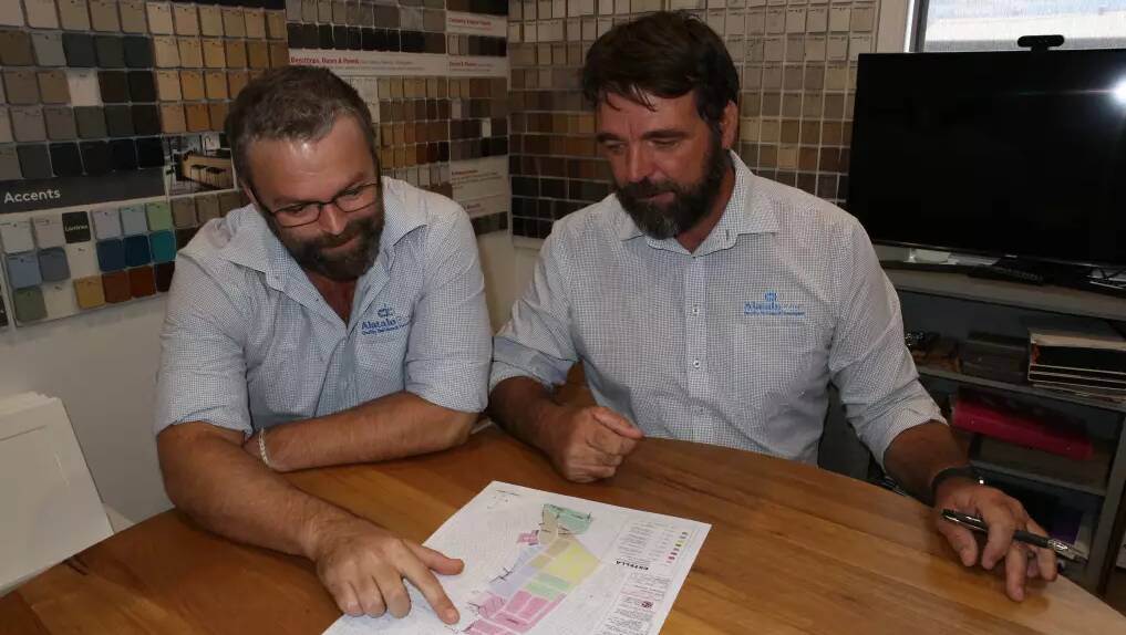 Alatalo Bros estimator Andrew Douglas and Wagga manager Paul Eady inspect the approval of a DA for more housing in Estella's north in 2023. Picture by Andrew Mangelsdorf