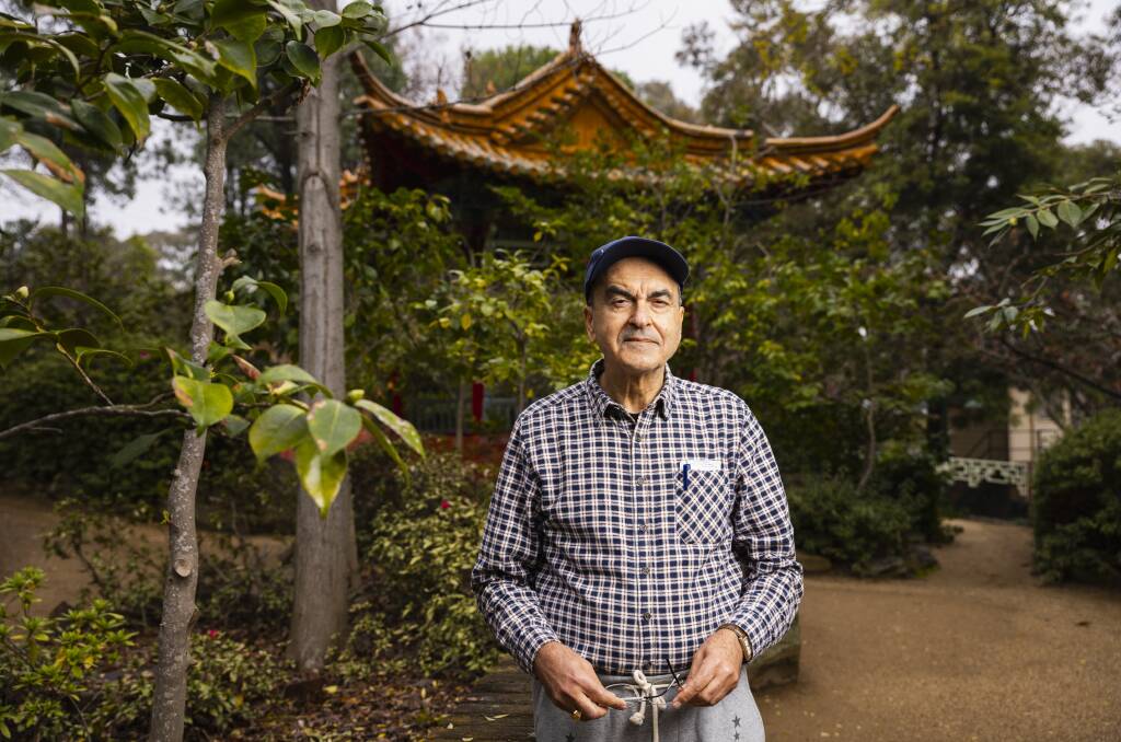 Former Wagga man Fred Delshad pictured at the Wagga botanical gardens with a Chinese-style pavilion built with the aid of Kunming workers as a bicentennial gift from the sister city to Wagga. Picture by Ash Smith