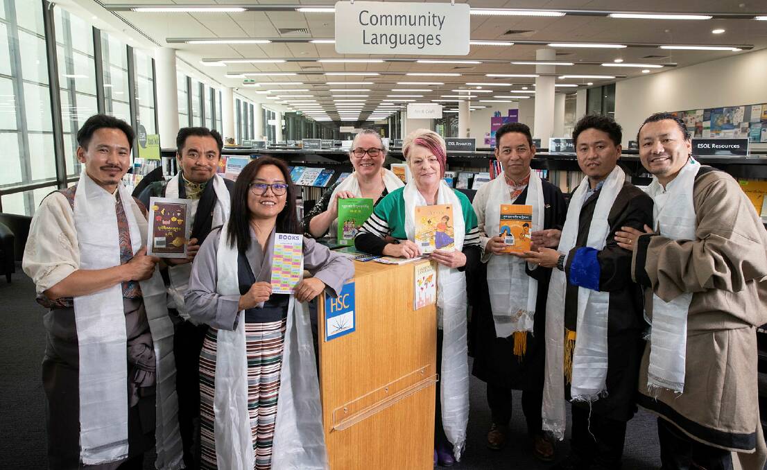 Wagga City Council library services manager Christine Bolton and Wagga Multicultural Council's Belinda Crain (centre) welcome the new Tibetan book collection from members of the Tibetan community, including Jinpa Gyatso (left), Kalsang Tsering, Tsering Tsomo, Karma Singey, Tenzin Doring and Gurbum Gyal. Picture by Madeline Begley