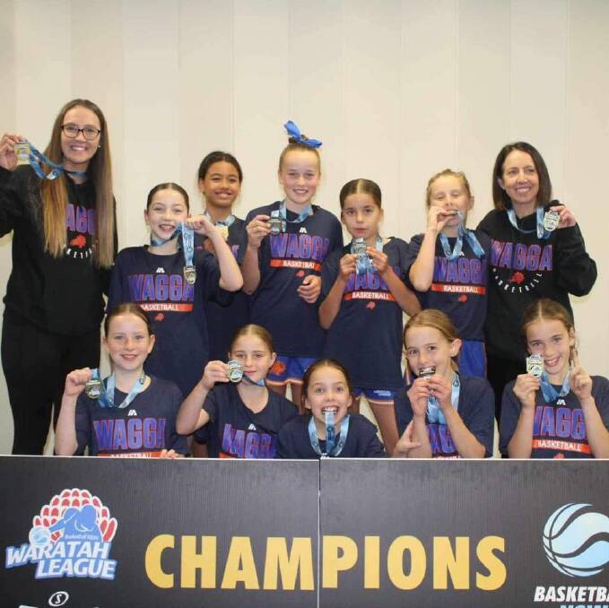 Basketball Wagga's under 12's Blaze team celebrates their division three grand final win over Canberra Nationals White. Picture from Basketball Wagga