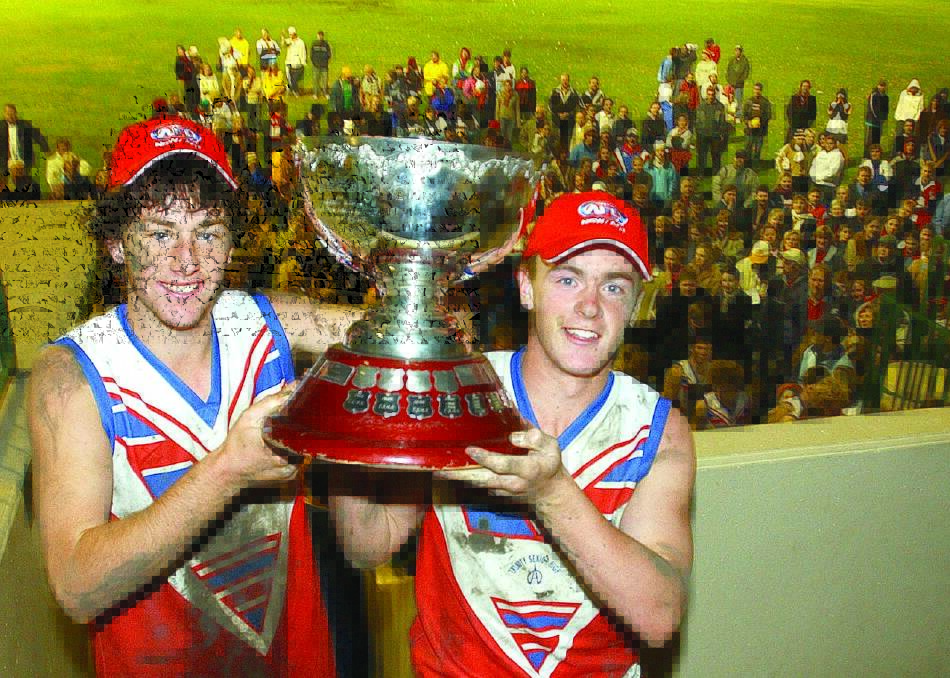 Geppert alongside Trinity co-captain Bryson Lashbrook following the 2003 Carroll Cup grand final. Picture by Les Smith