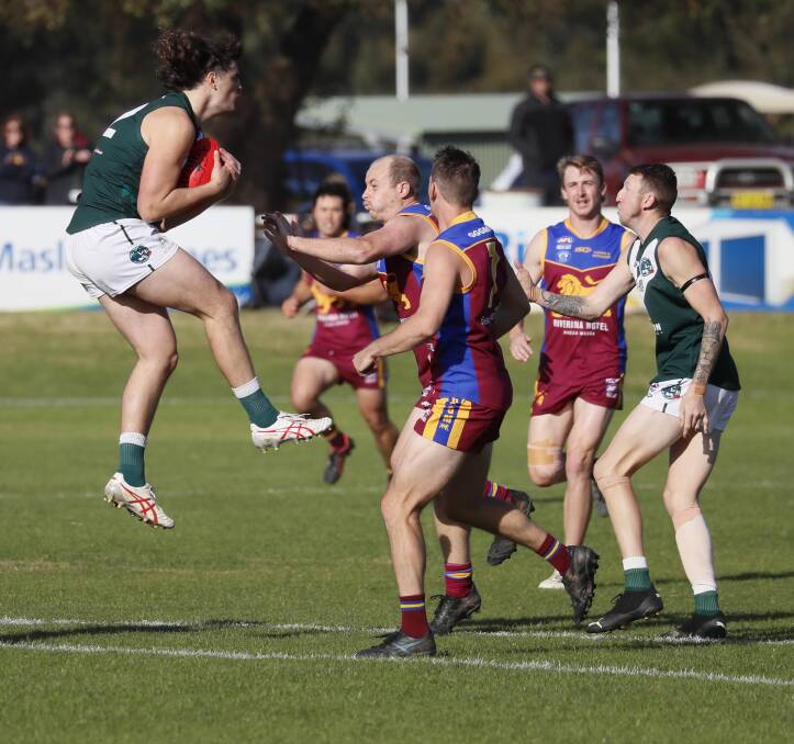 Coolamon forward Tim Oosterhoff takes a mark during the Hoppers epic win over GGGM on Sunday at Kindra Park. Picture by Les Smith