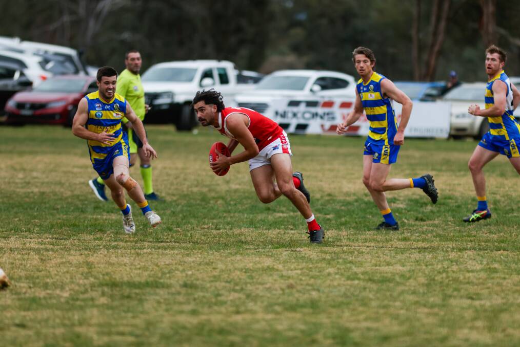 Collingullie-Wagga forward Harry Wichman looks for a teammate during the Demons clash against MCUE at Mangoplah Sportsground. Picture by Tom Dennis