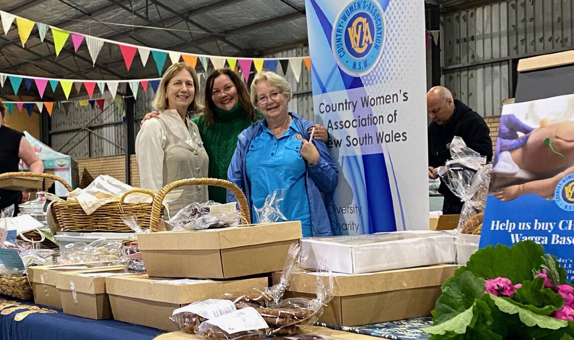 Clare Wotherspoon, Jacinta Finger and Maree Crosskell at a CWA stall. Picture supplied