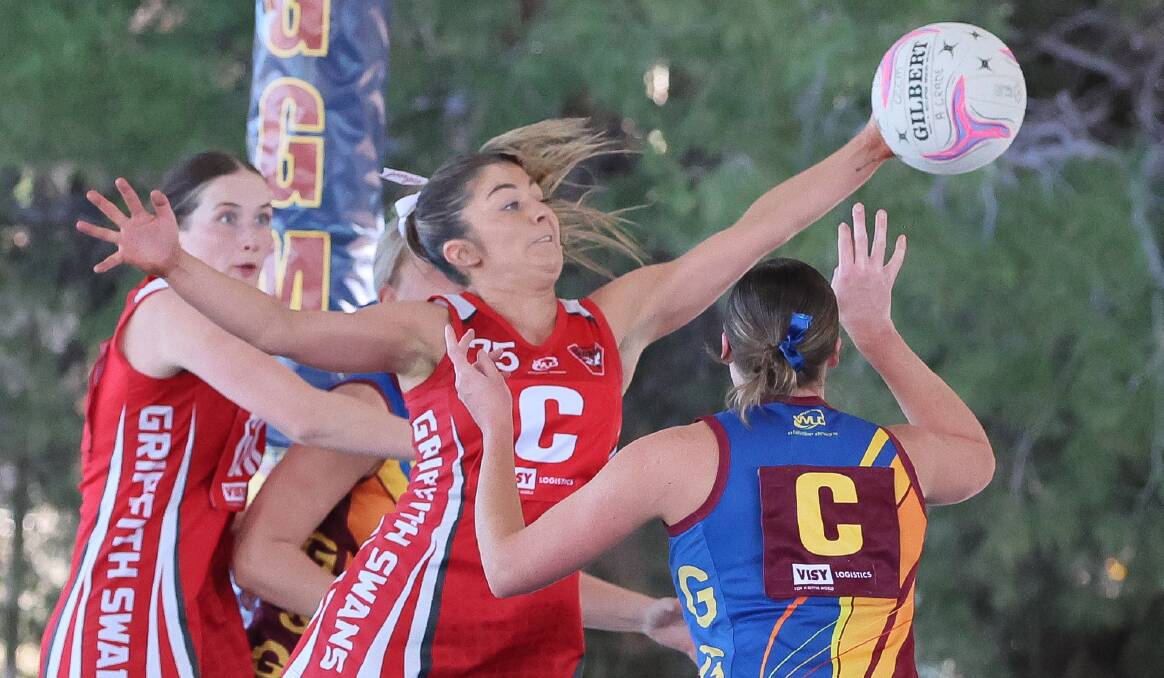 Griffith centre Geogia fuller deflects a centre pass by Ganmain-Grong Grong-Matong's Prue Walsh. Picture by Les Smith