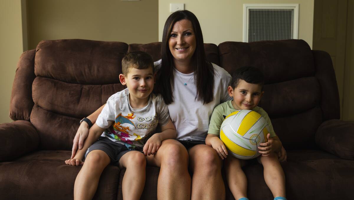 Tasha Tatton has recently moved to Australia from England and is already getting involved in local netball. Pictured with her sons Oscar Tatton, 6, (left) and Isaac Tatton, 3, (right). Picture by Ash Smith.