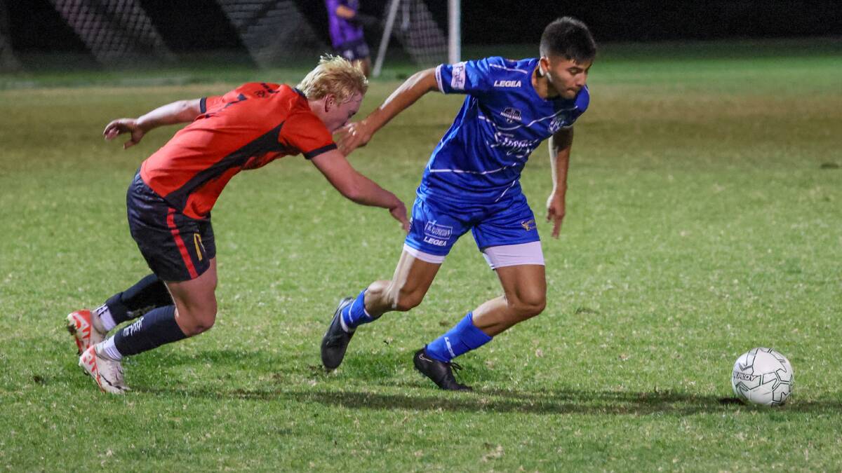 Lake Albert's Joshua Everingham turns to pursue Hanwood's Nazareno Tello in their round four draw at Rawlings Park. Picture by Les Smith