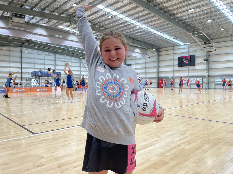 Kenda Mathers, 8, in her new Giants jumper ahead of the Super Netball preseason game in Wagga. Picture by Tahlia Sinclair