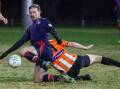 Henwood Park's playing coach Jake Ploenges beats Wagga United's Lachlan Carty to the ball. Picture by Les Smith