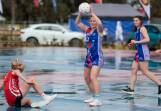 Griffith's Jasmin Gilmour falls while guarding Turvey Park's Lucy McIntyre. Several players slipped on the wet court in difficult wintry conditions. Picture by Bernard Humphreys
