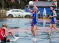 Griffith's Jasmin Gilmour falls while guarding Turvey Park's Lucy McIntyre. Several players slipped on the wet court in difficult wintry conditions. Picture by Bernard Humphreys