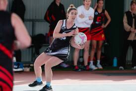 TRYC's Sophie Houghton steadies herself and looks down court for a passing target in their win over Marrar. Picture by Bernard Humphreys