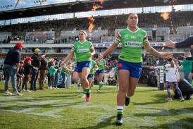 Canberra Raiders Tommaya Kelly-Sines and Ashleigh Quinlan run out on into Canberra Stadium in 2023. Picture by Elesa Kurtz