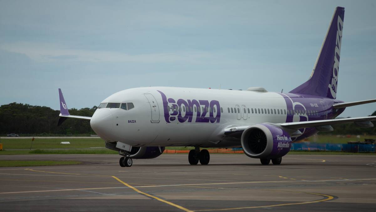 Bonza plane lands at Newcastle Airport. Picture Jonathan Carroll