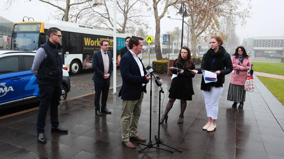 Newly re-elected NSW Nationals leader Paul Toole gives a press conference in downtown Wagga, flanked by local Nationals MLC Wes Fang, and Member for Wagga Joe McGirr. Picture by Les Smith