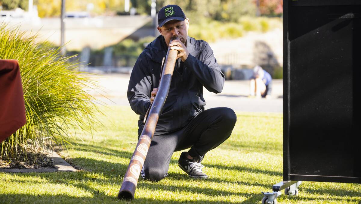 Wiradjuri man Luke Wighton plays didgeridoo at Wollundry Lagoon during yesterday's Sorry Day ceremony. Picture by Ash Smith