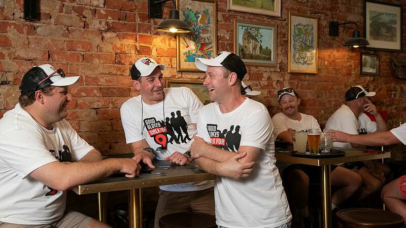 Tom Maguire, Tristan Robinson and Shaun Wallis are among the Good Blokes to stop for refreshments in North Wagga, partway through a nine hour walk. Picture by Madeline Begley