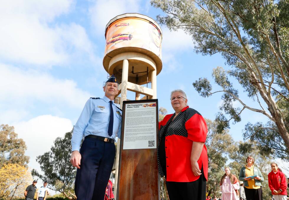 Air Commander Glen Braz from RAAF Glenbrook with Len Waters' daughter Julia Waters at Thursday's opening of the Uranquinty water tower mural. Picture by Les Smith