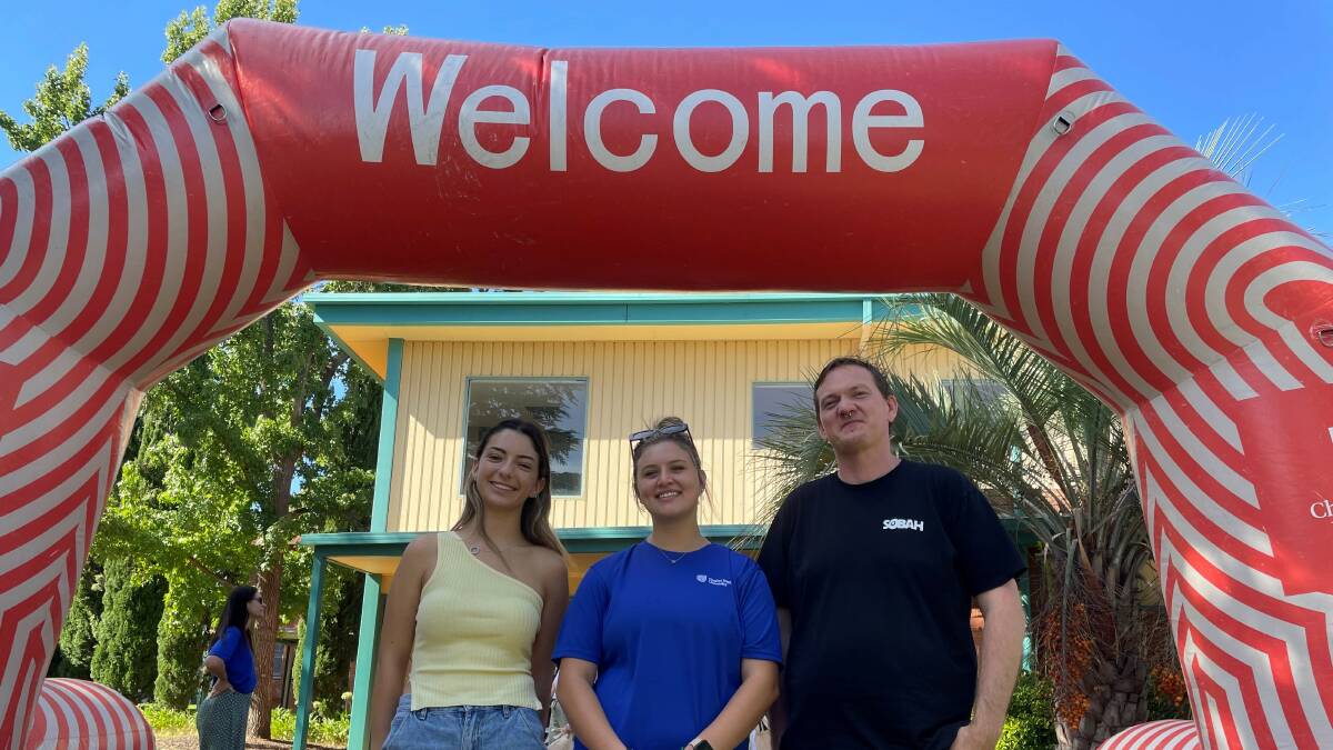 First-year animal science student Sarah Newton is welcomed to Wagga campus by O Week co-ordinator and third-year student Jeane Van Der Merwe and Associate Professor Chris Orchard. Picture by Les Smith