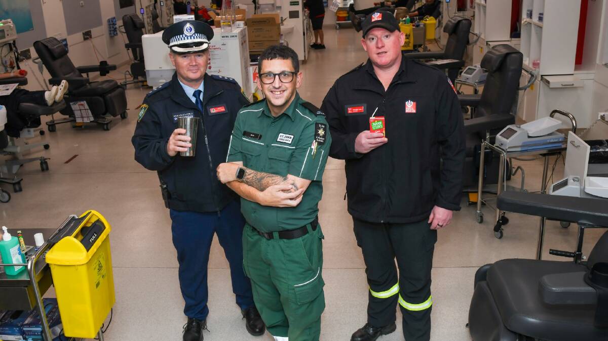 Police Inspector Rowan Harris, St John Ambulance volunteer Jacob Chapple and firefighter Ben Lesslie after giving blood at the Lifeblood Wagga Donor Centre. Picture by Bernard Humphreys 