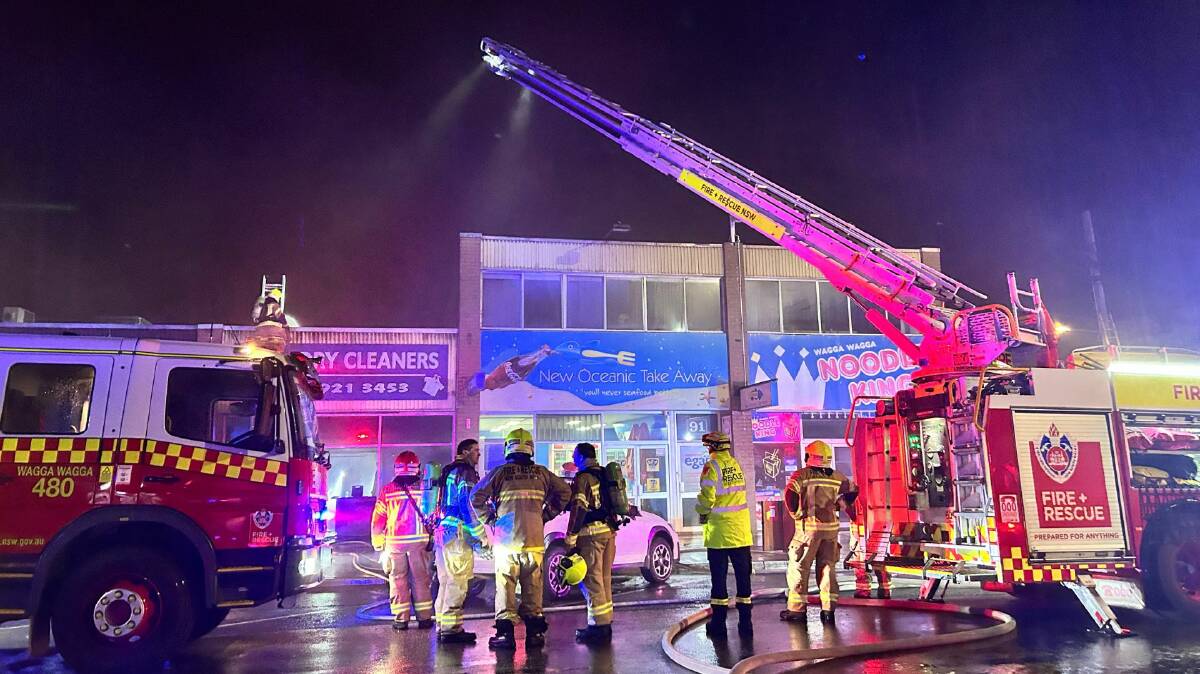 Emergency services at the scene of a fire that engulfed Wagga Dry Cleaners on June 6. Picture by Emily Anderson
