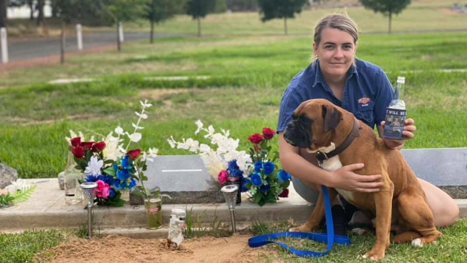 HEARTACHE: Maddie Bott visits the grave of her ex-fiance, Ethan Hunter, with dog Knox on what was meant to be their wedding day. Picture: Supplied 