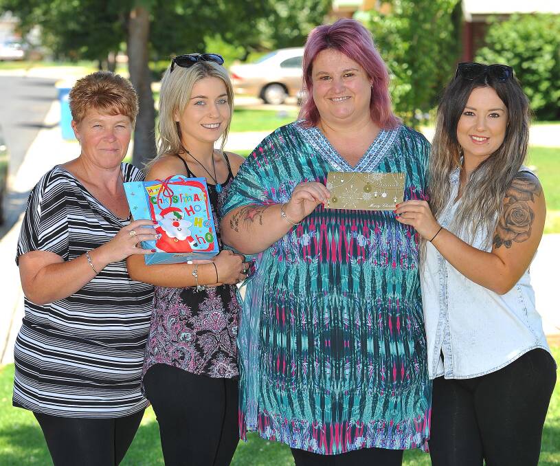 SPIRIT OF GIVING: Natelie Tilden (second from right) with colleagues Lisa Kelleher, Kacie Lavers and Paige Duck who helped save her Christmas. Picture: Kieren L Tilly