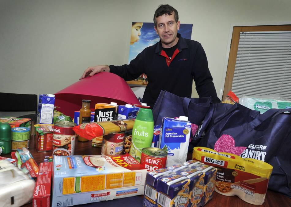 INCREASED DEMAND: Anglicare Riverina general manager Brad Addison with left over donations from the pantry appeal. Picture: Les Smith