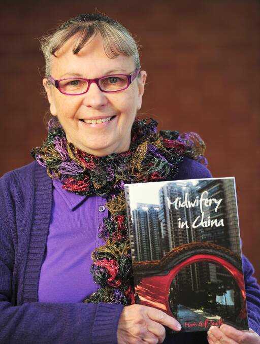 ONE WOMAN'S JOURNEY: Mavis Gaff-Smith with her 9th book. The book is being released to coincide with International Midwives Day on May 5. Picture: Kieren L Tilly