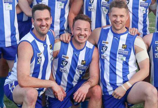 Former Riverina footballers Matt Suckling, Scott Burge and Daniel Hitchens are all smiles after Tumbarumba's win on Saturday. Picture by Wendy Lavis