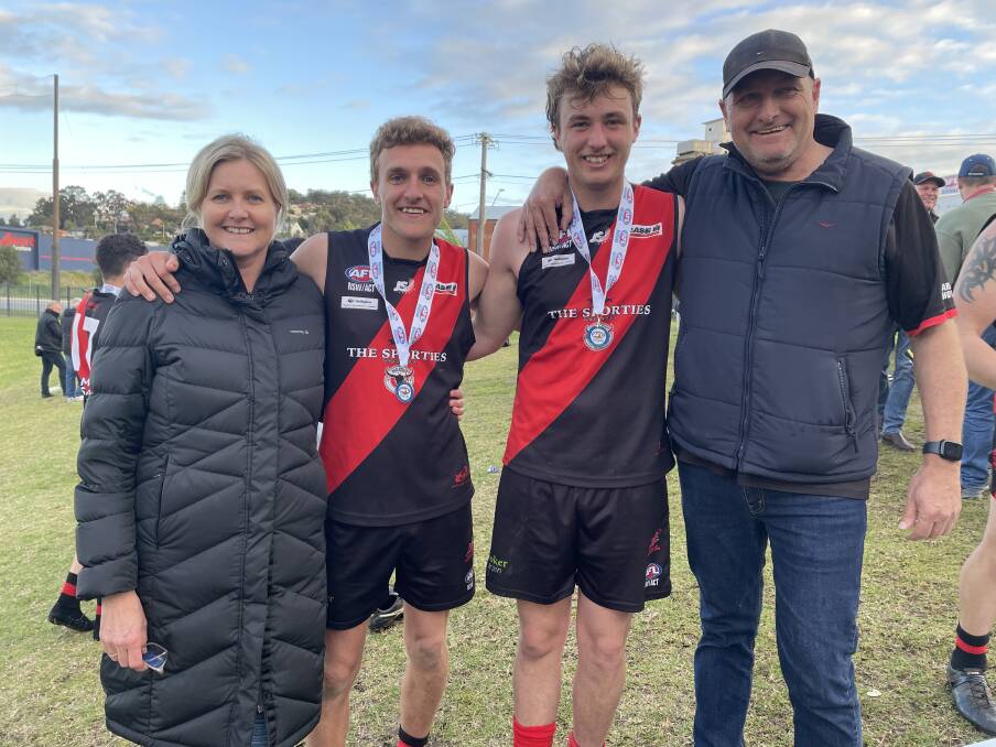 Meg and Mick Reynolds with sons Jack and Harry after their premiership win for Marrar on Saturday. Picture by Matt Malone