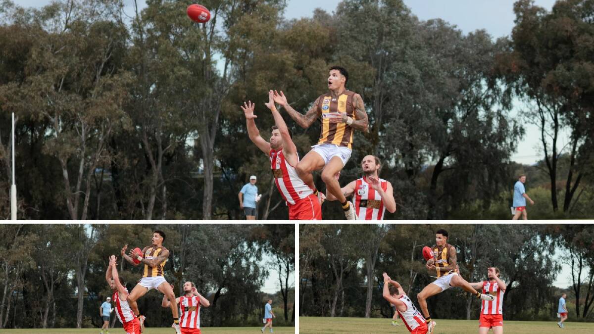 East Wagga-Kooringal's Jarrad Boumann soars over Charles Sturt University's Sam Barrow to pull in a spectacular mark in the Farrer League game at Peter Hastie Oval on Saturday. Pictures by Bernard Humphreys