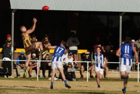 East Wagga-Kooringal's Jerry Maslin takes a big mark in front of the Hawks' faithful in the Farrer League game against Temora at Gumly Oval on Saturday. Picture by Tom Dennis