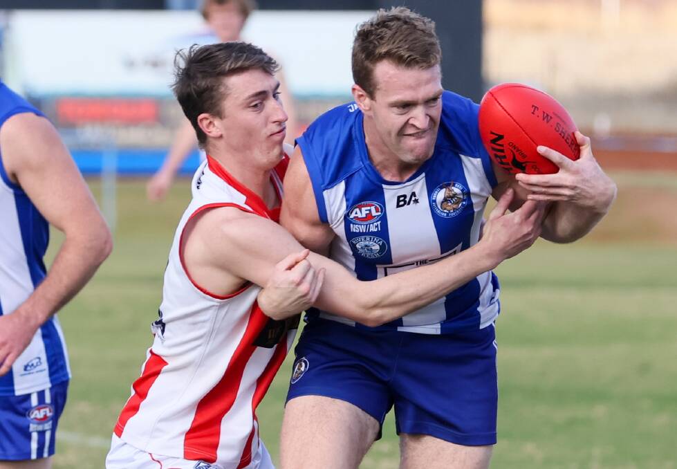 First-year Charles Sturt University midfielder Ollie Wortley (left) tackles Temora co-captain Clancy Mackey last week. Wortley will miss this week after returning home to Victoria. Picture by Les Smith