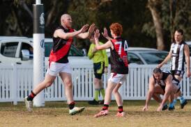 Marrar full-forward Kieran Emery celebrates a goal with Judd Withers in the Farrer League game against The Rock-Yerong Creek at Victoria Park on Sunday. Picture by Bernard Humphreys