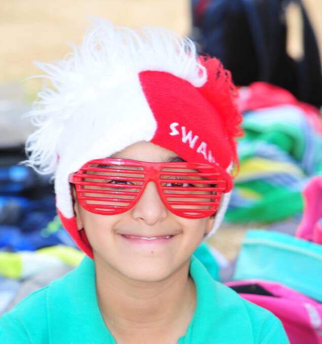 SWANS FAN: Mark George, 9, shows plenty of colour at the Lutheran carnival. 