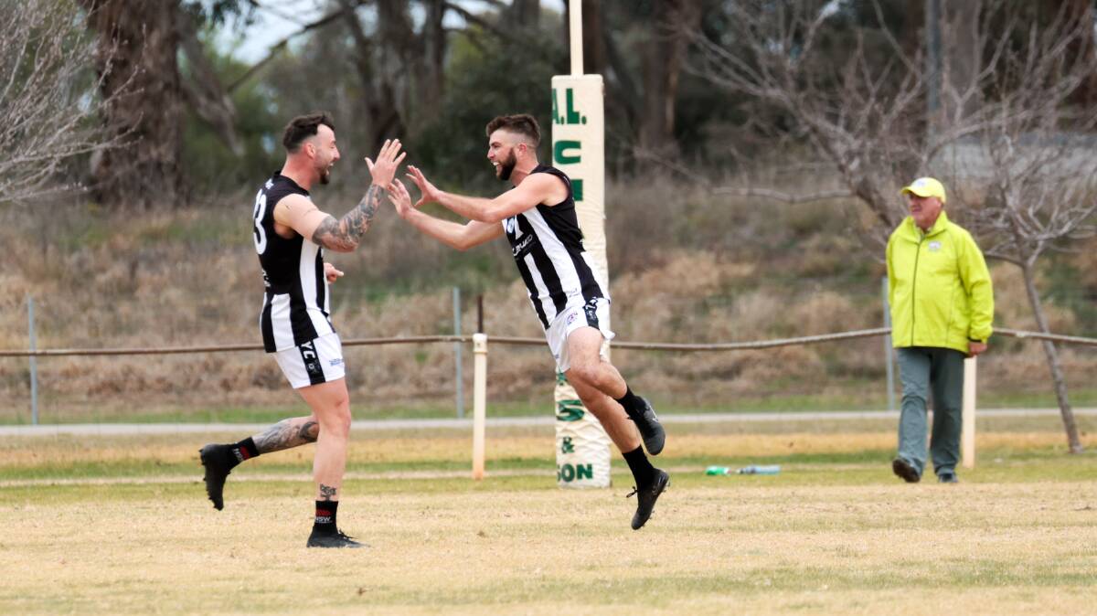 The Rock-Yerong Creek's Dean Biermann and Jordy Kemp celebrate a goal against Northern Jets at Ariah Park Sportsground on Saturday. Picture by Bernard Humphreys