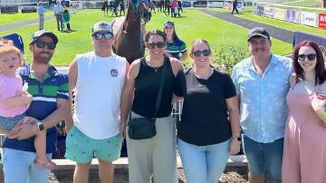 Some happy owners, in front of Future Fund and trainer Maddy Collins, celebrate the win at Murrumbidgee Turf Club on Thursday. Picture by Murrumbidgee Turf Club